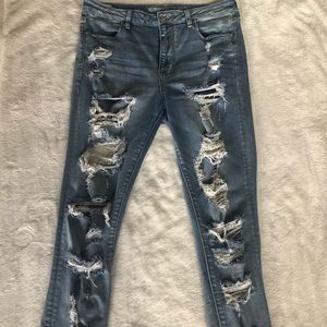 light blue aeo jeans, rips all down front and back